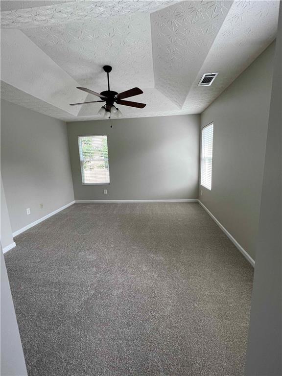 503 Sautee Place Canton, GA 30114 - Photo 9 of 17 an empty room with windows and fan