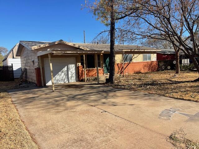 306 52nd Street Lubbock, TX 79404 - Photo 23 of 26 a view of a house with snow on the wall and trees