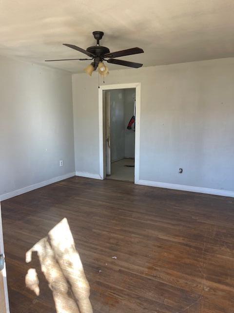 306 52nd Street Lubbock, TX 79404 - Photo 9 of 26 a view of empty room with wooden floor