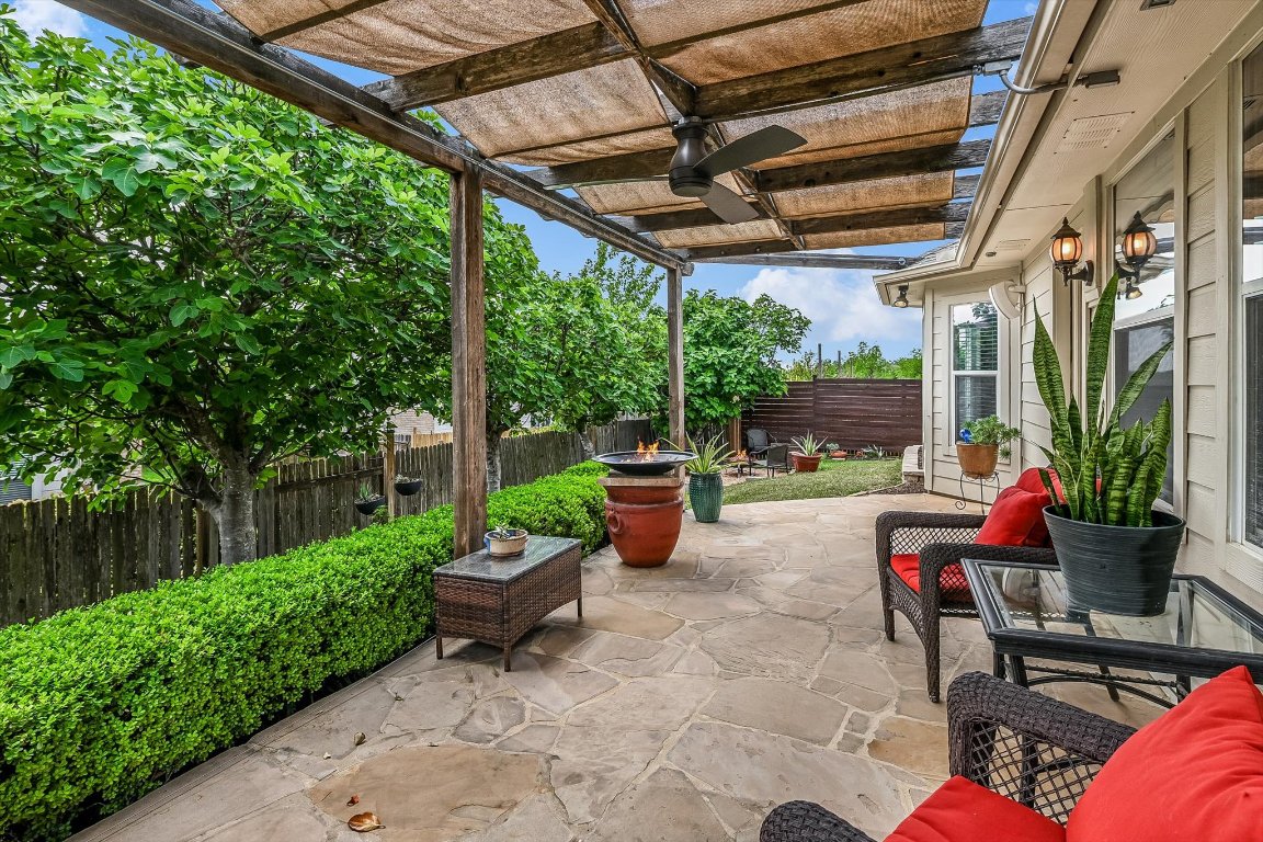 2001 Short Summer Drive Austin, TX 78754 - Photo 1 of 1 a view of a patio with table and chairs potted plants with wooden floor and fence