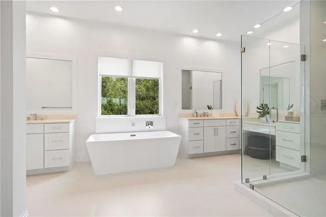 a very nice looking rest room with a large window