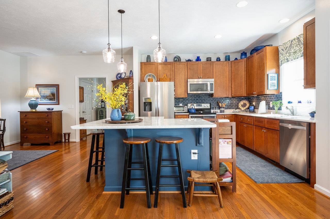 102 Millview Drive Bridgewater, VA 22812 - Photo 11 of 59 a kitchen with a table chairs sink and cabinets
