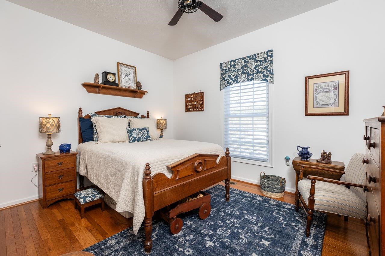 102 Millview Drive Bridgewater, VA 22812 - Photo 32 of 59 a bedroom with a bed and wooden floor