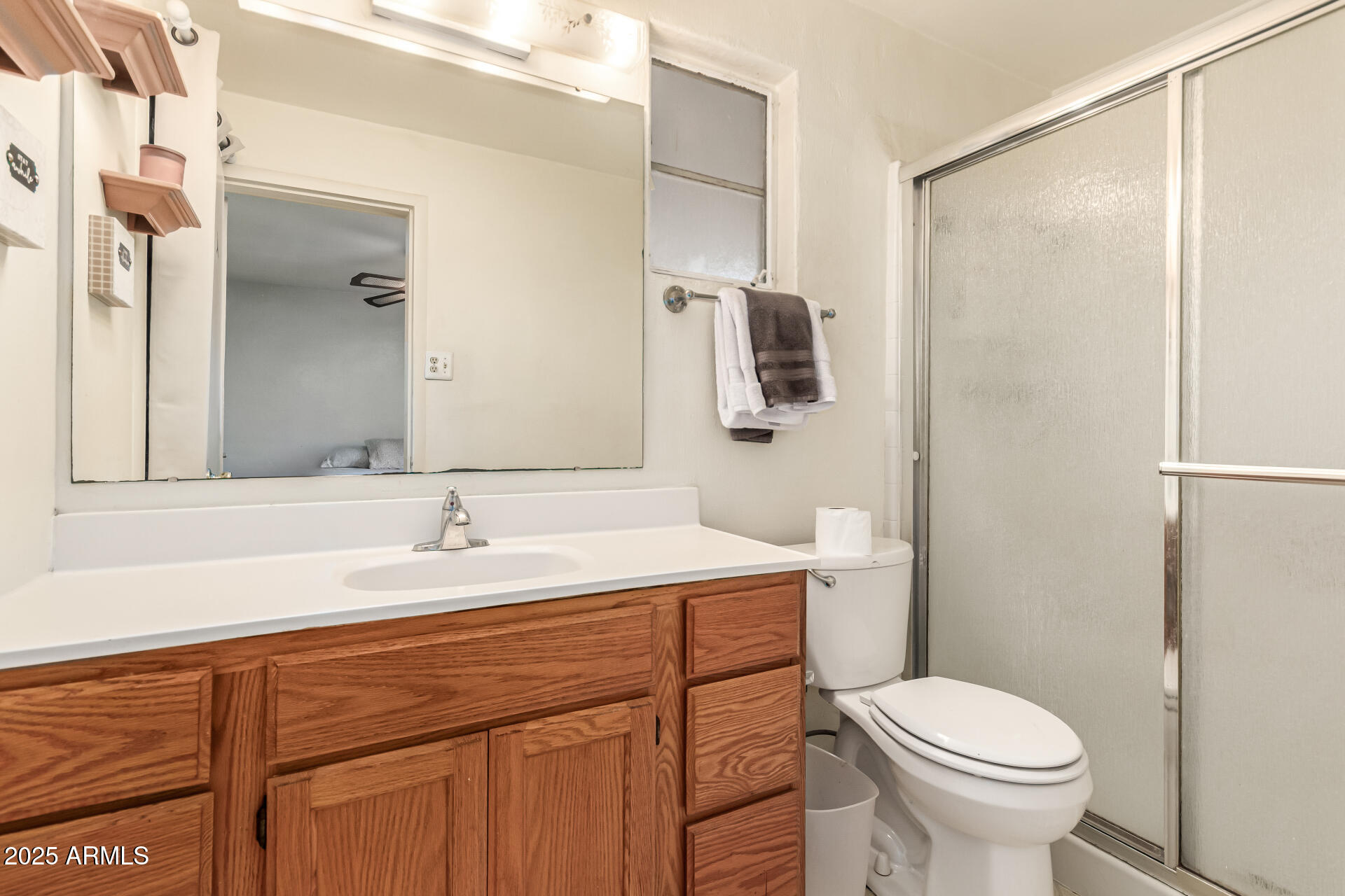 710 East Atlanta Avenue Phoenix, AZ 85040 - Photo 13 of 21 a bathroom with a sink toilet and mirror