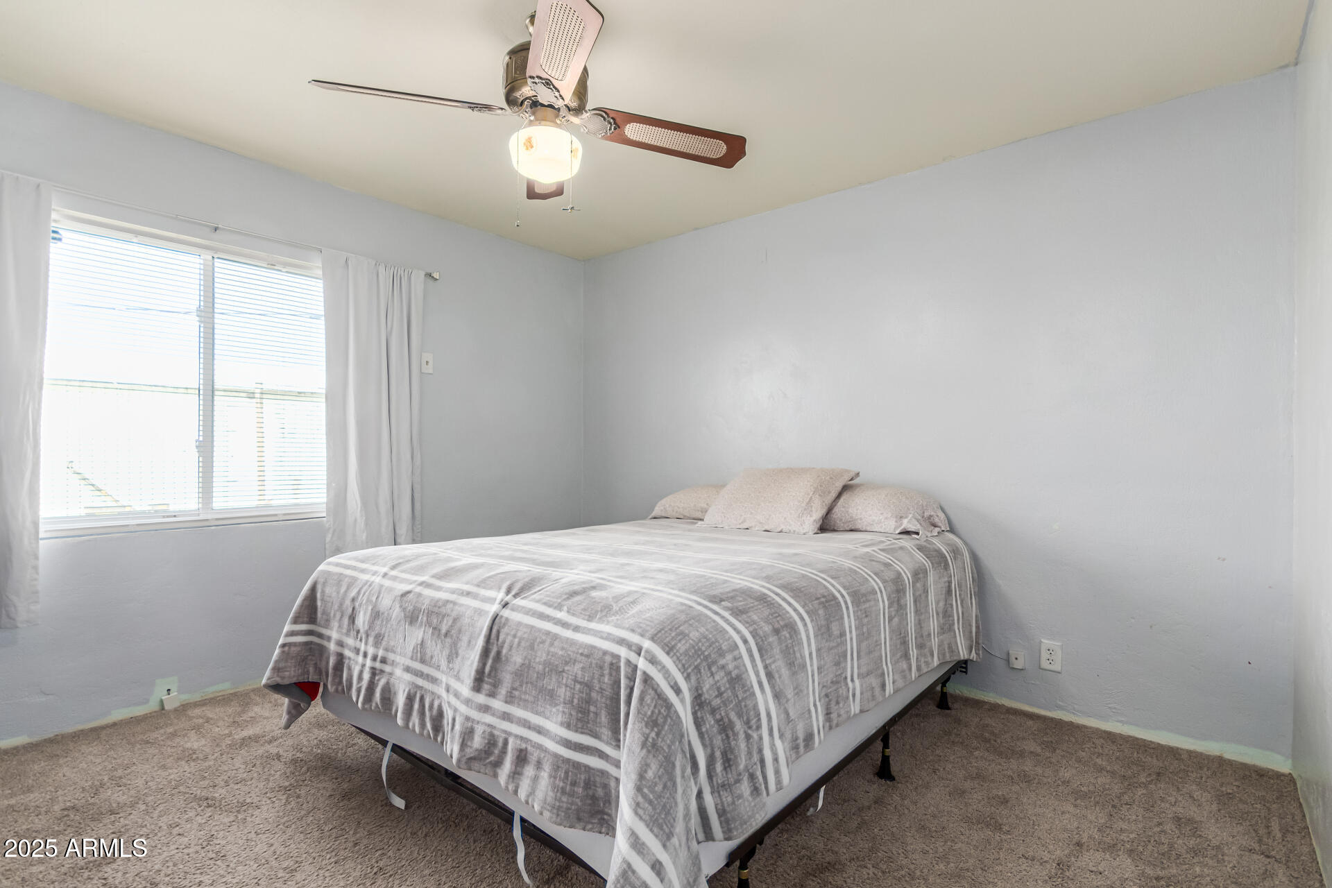 710 East Atlanta Avenue Phoenix, AZ 85040 - Photo 14 of 21 a bedroom with a bed and window