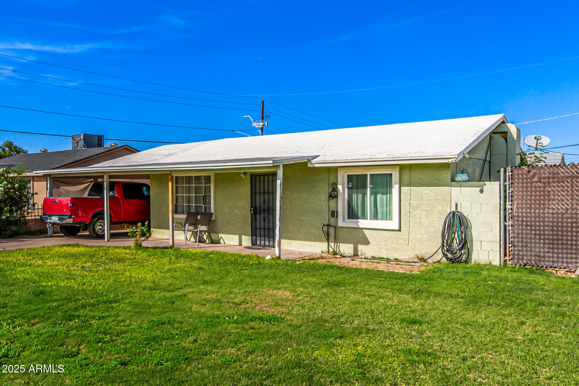 710 East Atlanta Avenue Phoenix, AZ 85040 - Photo 3 of 21 a front view of a house with a garden and porch