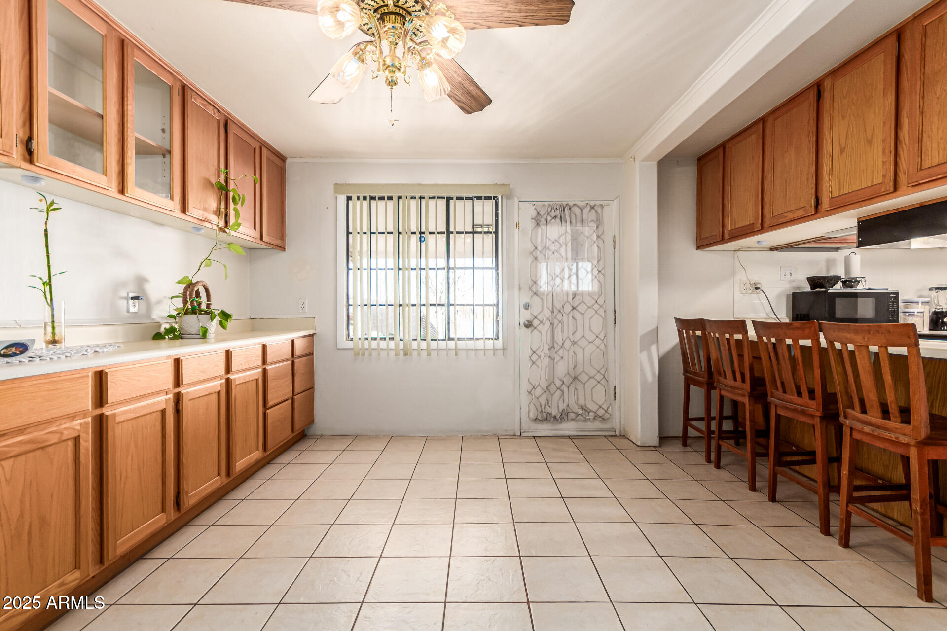 710 East Atlanta Avenue Phoenix, AZ 85040 - Photo 4 of 21 a kitchen with stainless steel appliances a cabinets and window