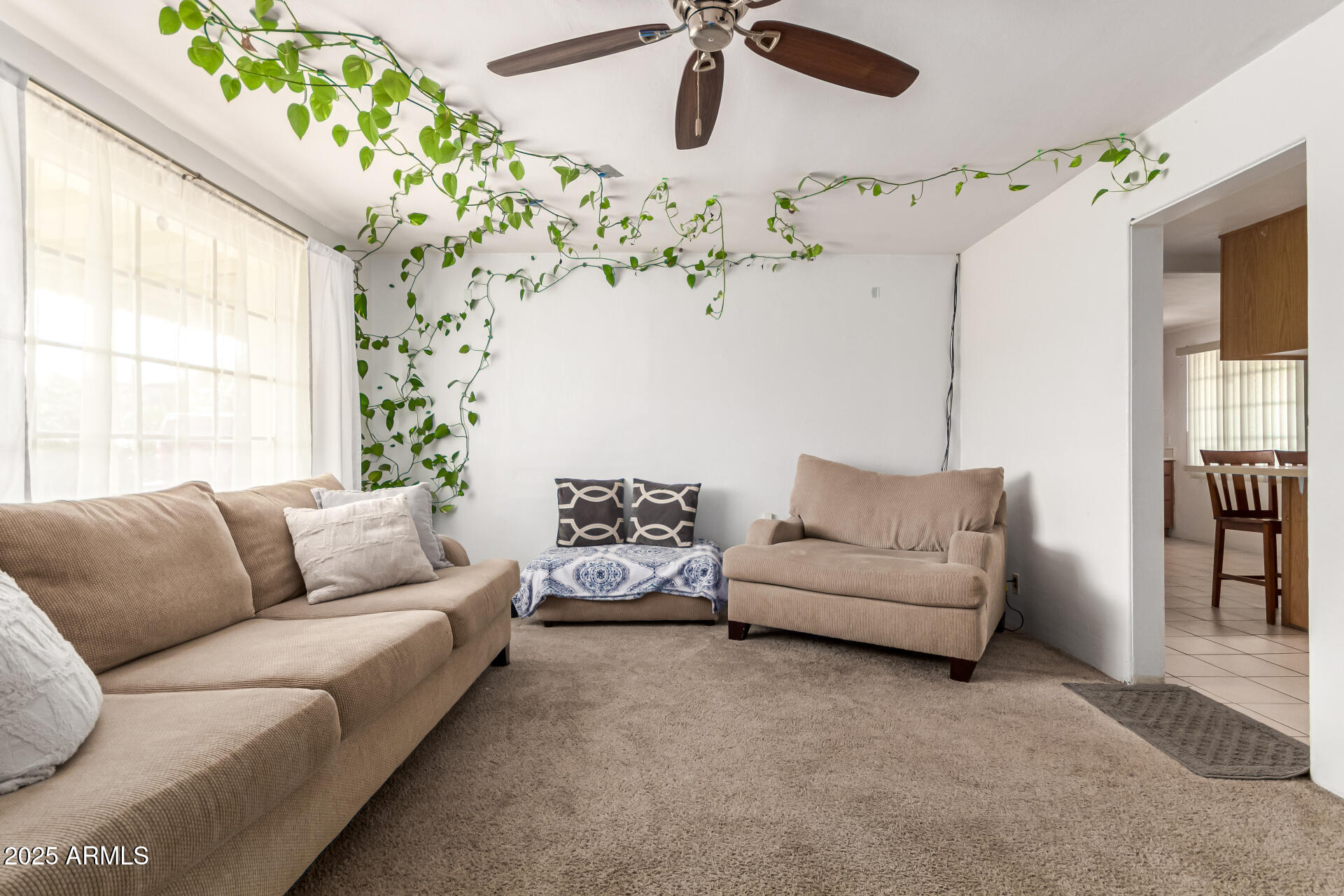 710 East Atlanta Avenue Phoenix, AZ 85040 - Photo 9 of 21 a living room with furniture and a chandelier