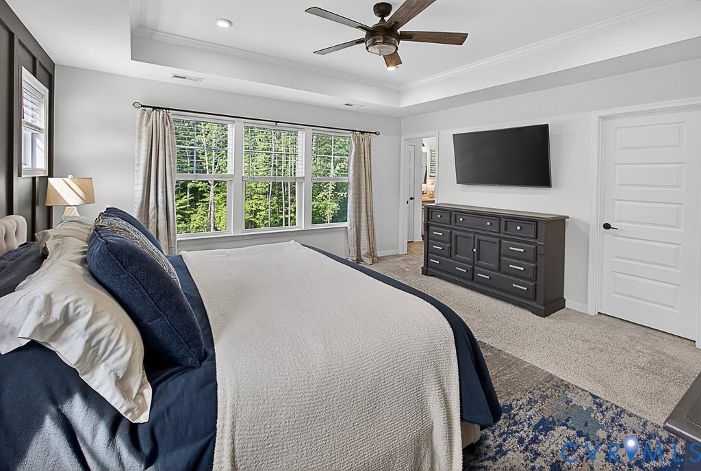 18517 Palisades Ridge Moseley, VA 23120 - Photo 21 of 55 a bedroom with a bed and a flat screen tv