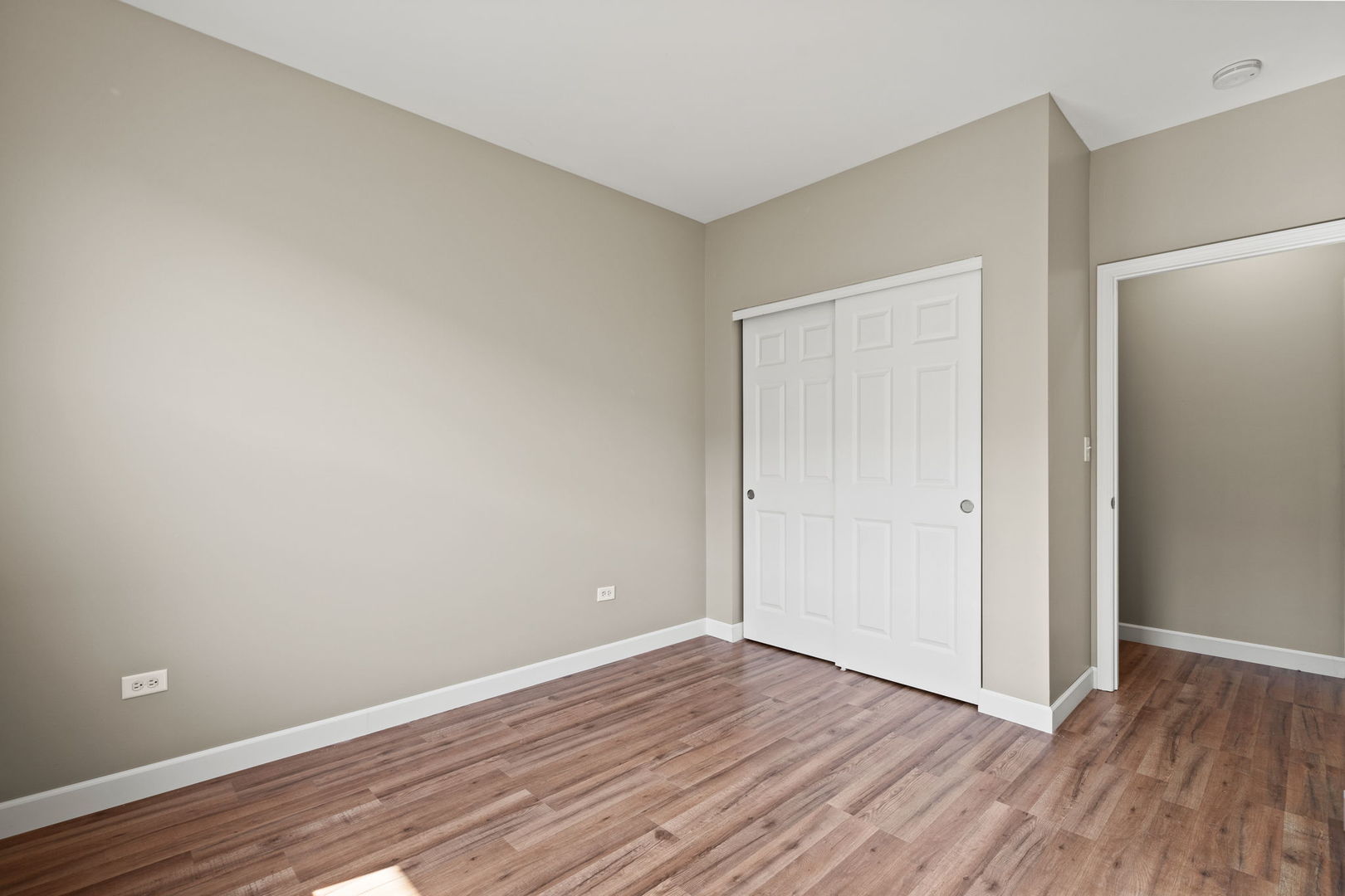 2568 Golf Ridge Circle, Unit 2568 Naperville, IL 60563 - Photo 13 of 18 a view of an empty room with wooden floor and closet