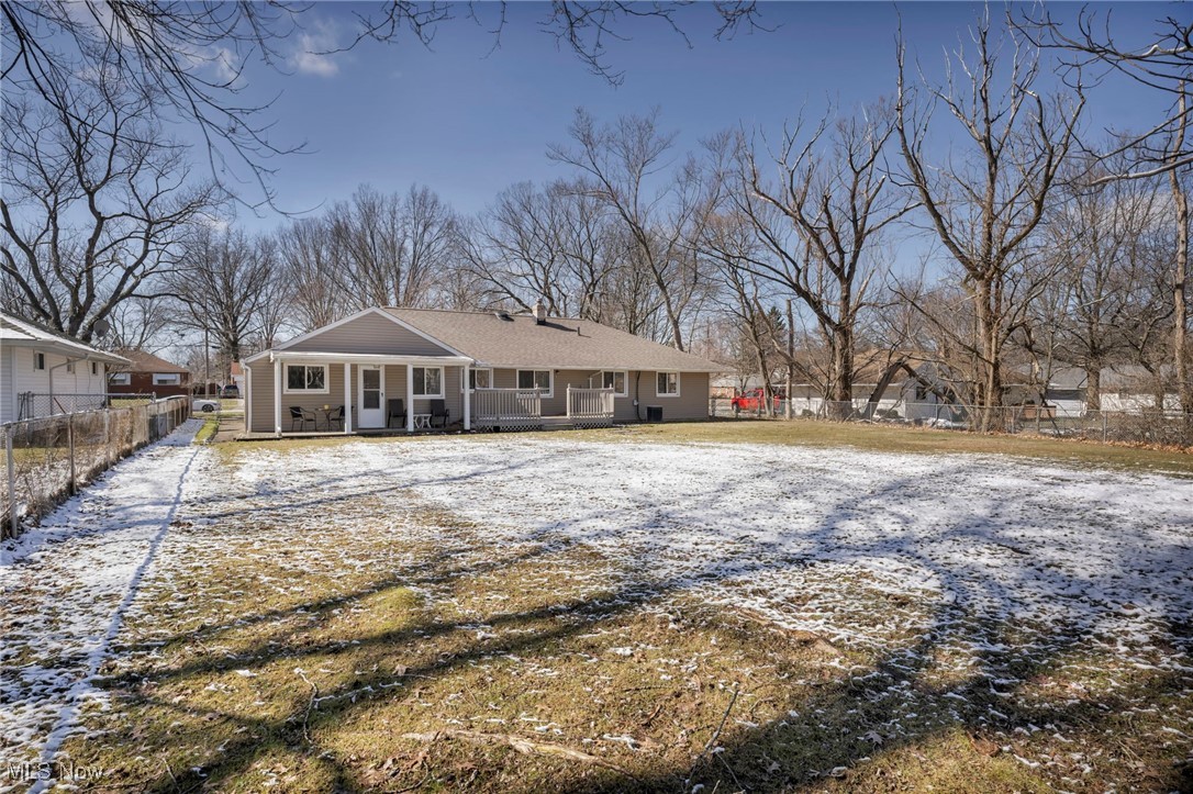 475 Harris Road Cleveland, OH 44143 - Photo 5 of 38 Snow covered house featuring covered porch and fence