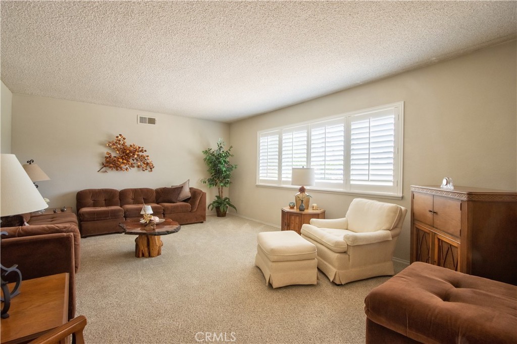 335 Zada Lane Vista, CA 92084 - Photo 12 of 44 a living room with furniture and a large window