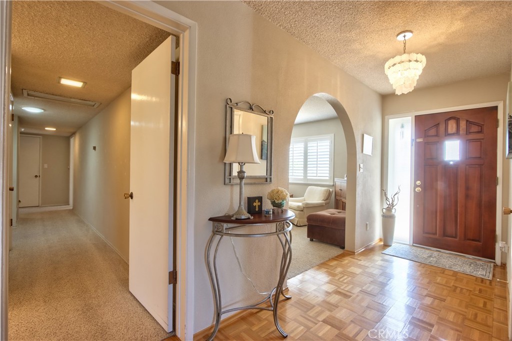 335 Zada Lane Vista, CA 92084 - Photo 18 of 44 a view of a hallway with wooden floor and living room