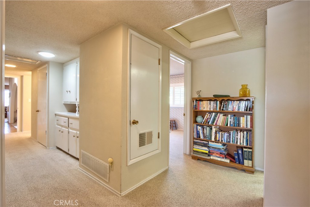 335 Zada Lane Vista, CA 92084 - Photo 19 of 44 a view of an empty room with window and cabinet