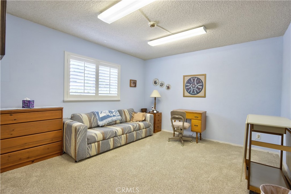 335 Zada Lane Vista, CA 92084 - Photo 22 of 44 a bedroom with furniture and a window