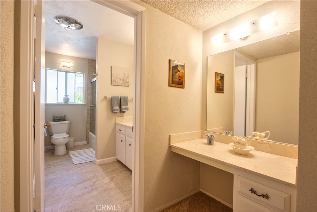 335 Zada Lane Vista, CA 92084 - Photo 24 of 44 a spacious bathroom with a double vanity sink a mirror and a toilet