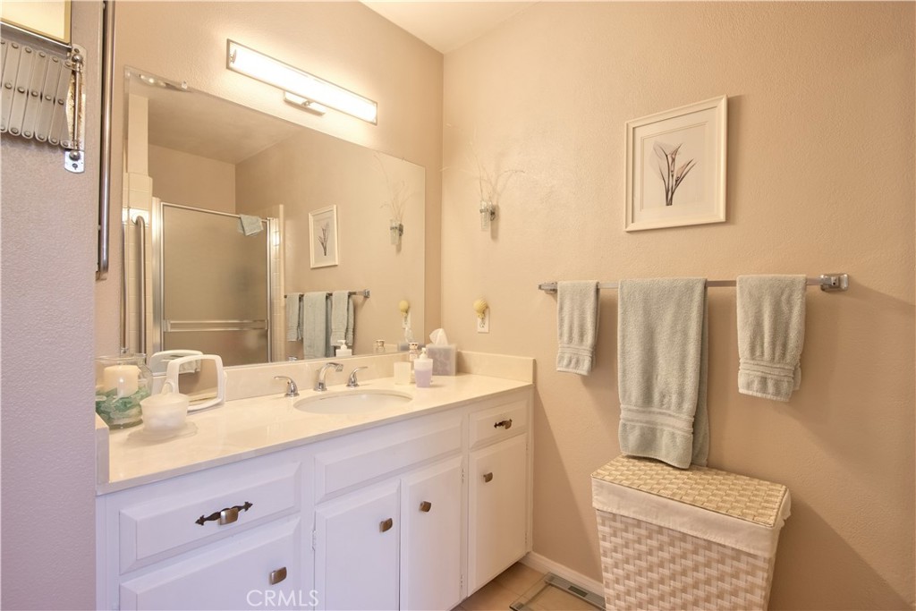 335 Zada Lane Vista, CA 92084 - Photo 28 of 44 a bathroom with a double vanity sink and a mirror