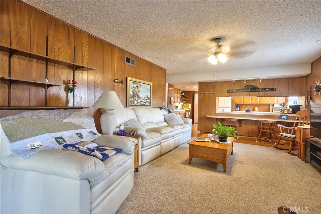 335 Zada Lane Vista, CA 92084 - Photo 3 of 44 a living room with furniture kitchen view and a chandelier