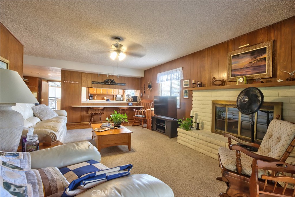335 Zada Lane Vista, CA 92084 - Photo 6 of 44 a living room with furniture a window and gym equipment