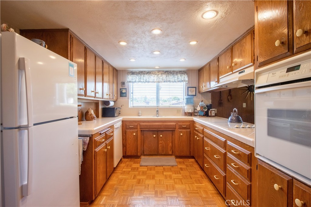 335 Zada Lane Vista, CA 92084 - Photo 9 of 44 a large kitchen with stainless steel appliances lots of counter top space