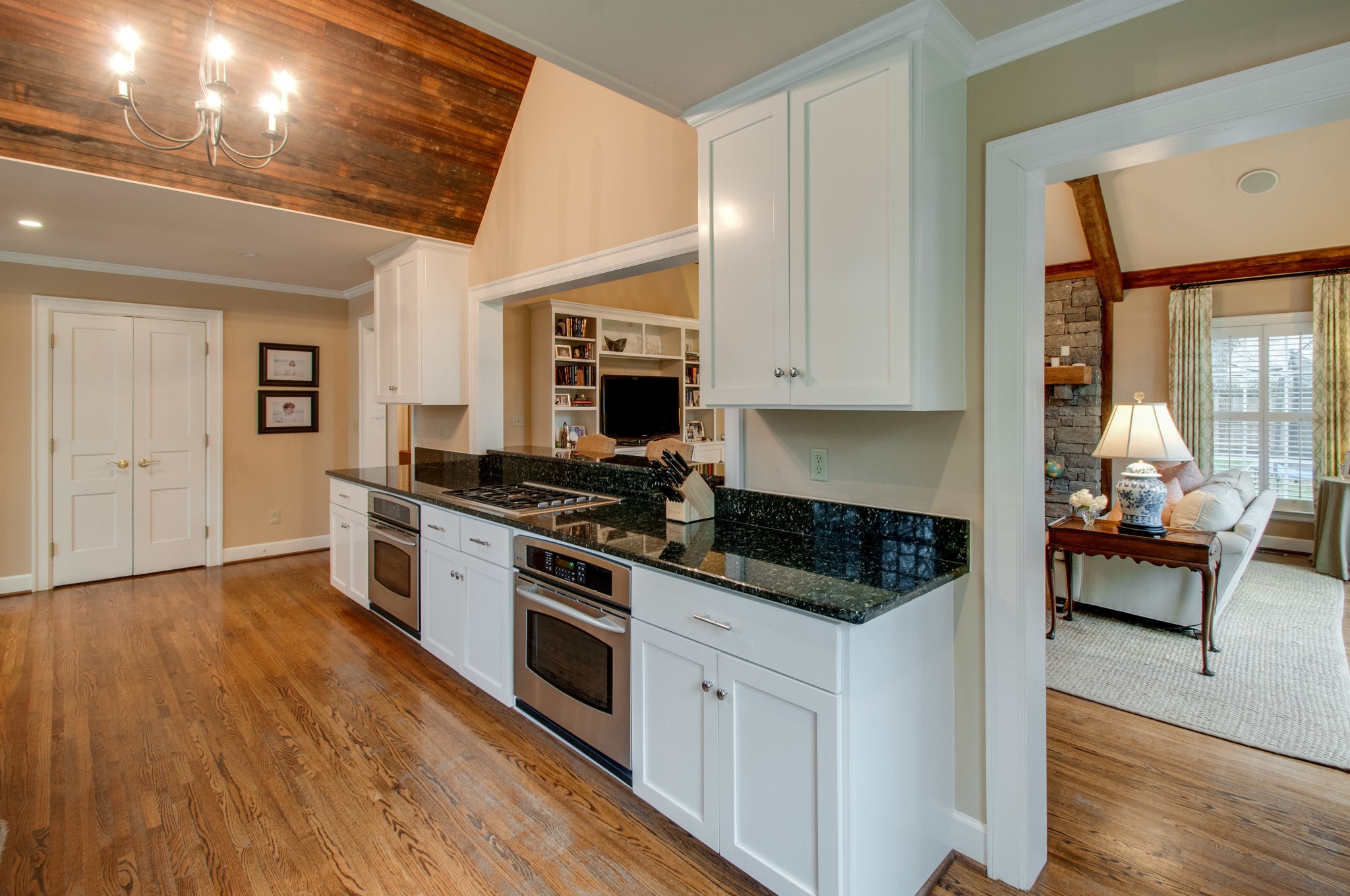 144 Cheek Road Nashville, TN 37205 - Photo 8 of 15 a kitchen with granite countertop a stove and a wooden floors