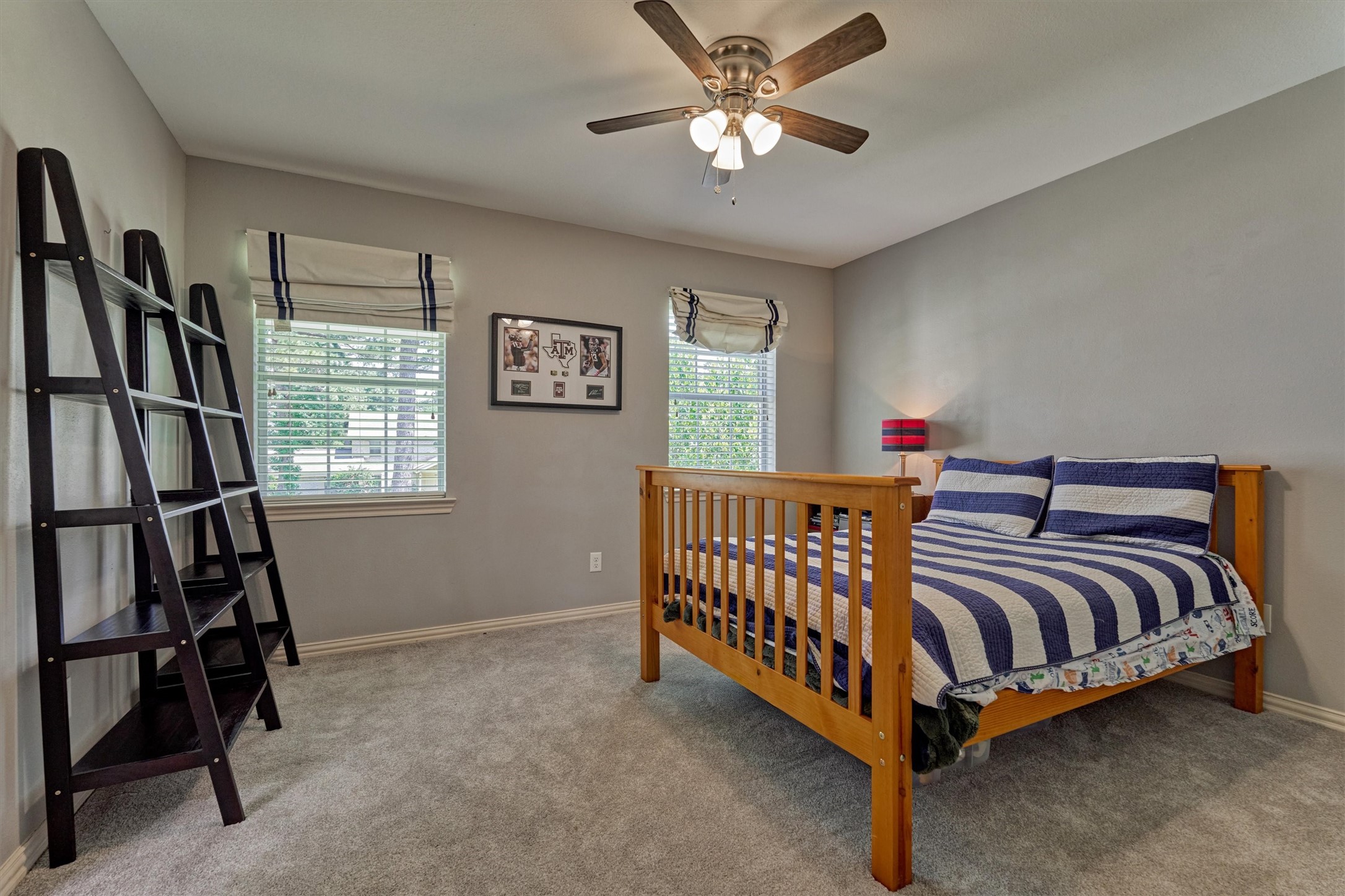 6515 Glenhill Drive Spring, TX 77389 - Photo 25 of 39 a spacious bedroom with a bed and a window