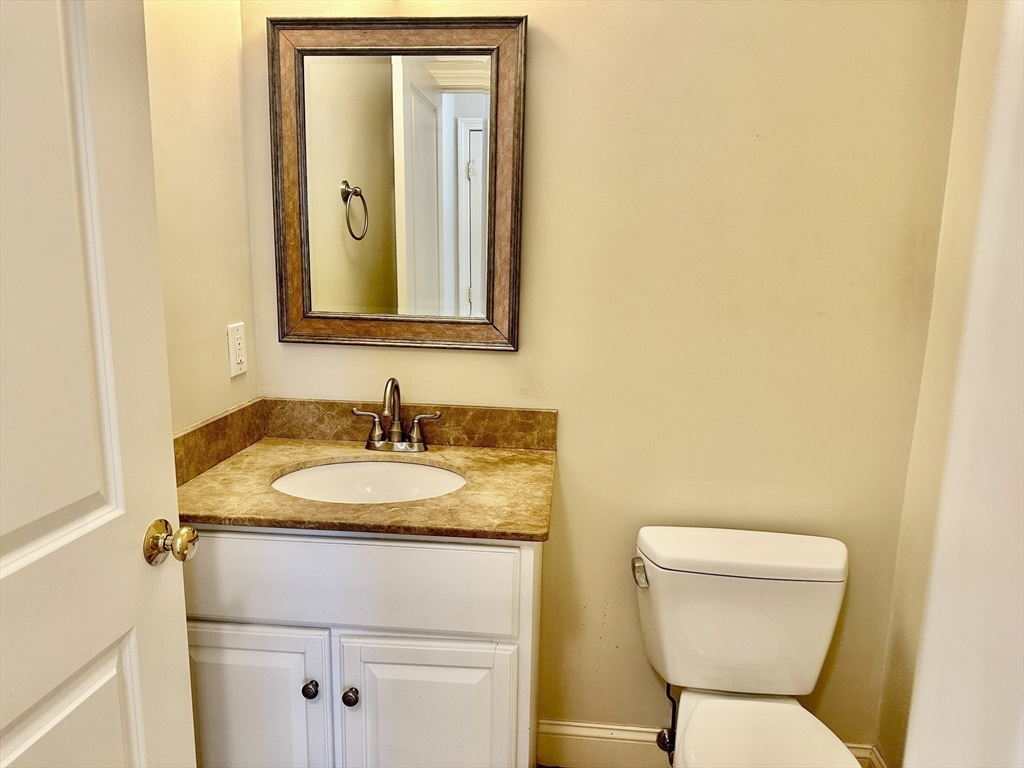 183 Summer Street, Unit 183 Watertown, MA 02472 - Photo 6 of 12 a bathroom with a sink and a toilet