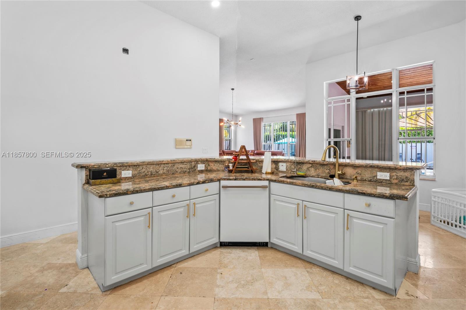 5750 Southwest 67th Avenue Miami, FL 33143 - Photo 25 of 62 a spacious bathroom with a granite countertop sink and a mirror