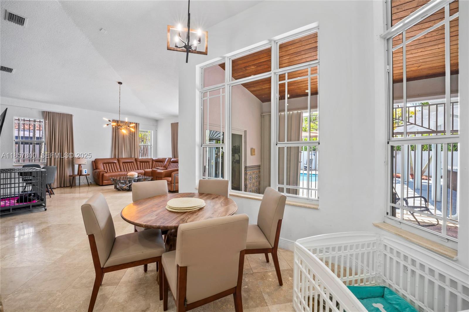 5750 Southwest 67th Avenue Miami, FL 33143 - Photo 27 of 62 a view of a dining room with furniture window and wooden floor