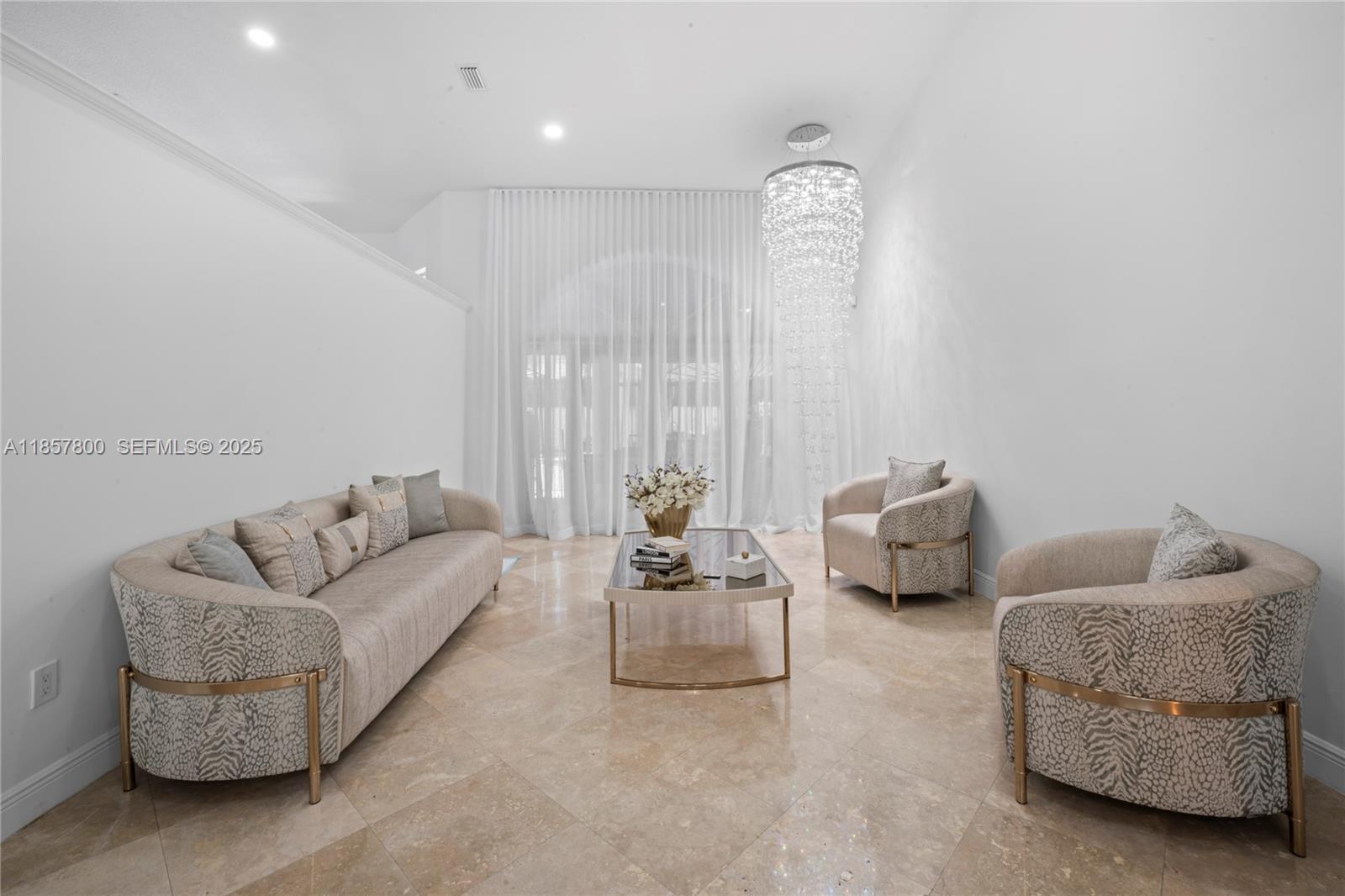 5750 Southwest 67th Avenue Miami, FL 33143 - Photo 31 of 62 a living room with furniture and a window