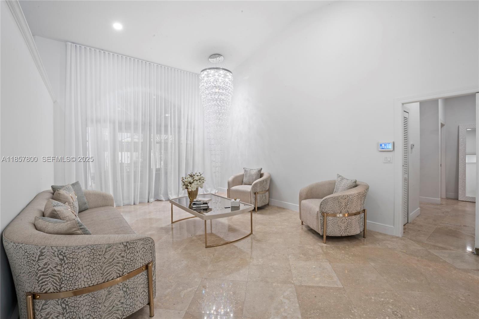 5750 Southwest 67th Avenue Miami, FL 33143 - Photo 32 of 62 a living room with furniture and a large window