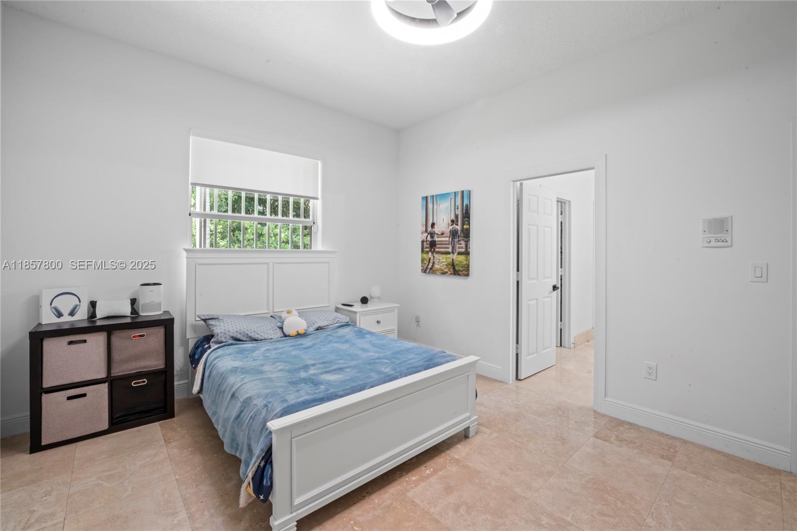 5750 Southwest 67th Avenue Miami, FL 33143 - Photo 41 of 62 a bedroom with a bed and a cabinets