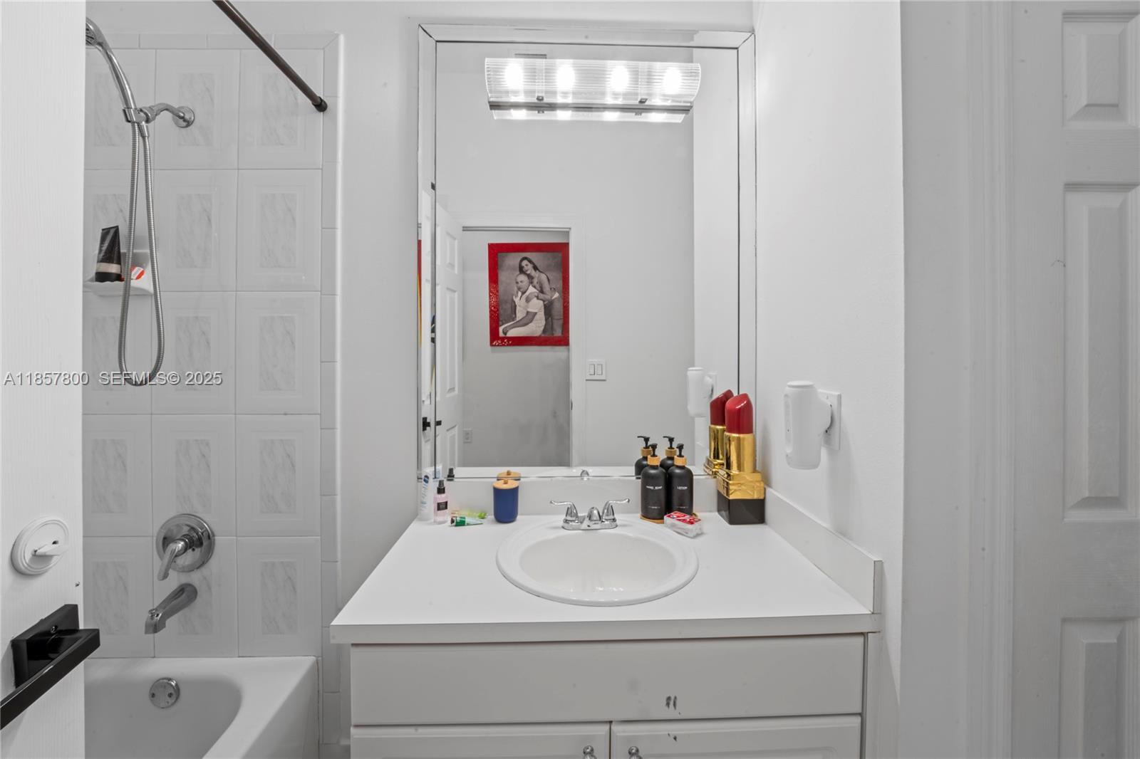 5750 Southwest 67th Avenue Miami, FL 33143 - Photo 43 of 62 a bathroom with a sink a toilet and shower