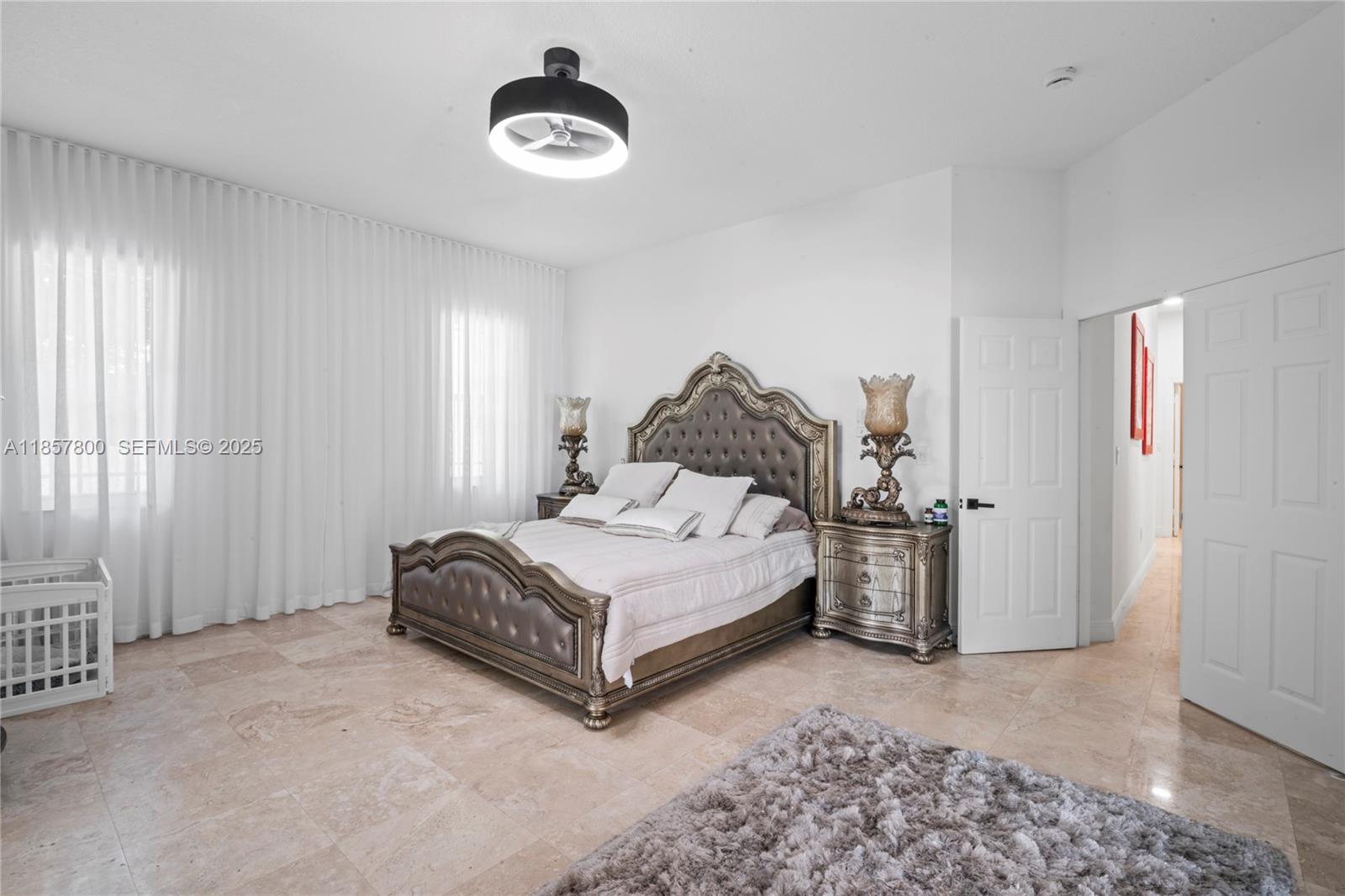 5750 Southwest 67th Avenue Miami, FL 33143 - Photo 45 of 62 a spacious bedroom with a bed and a window