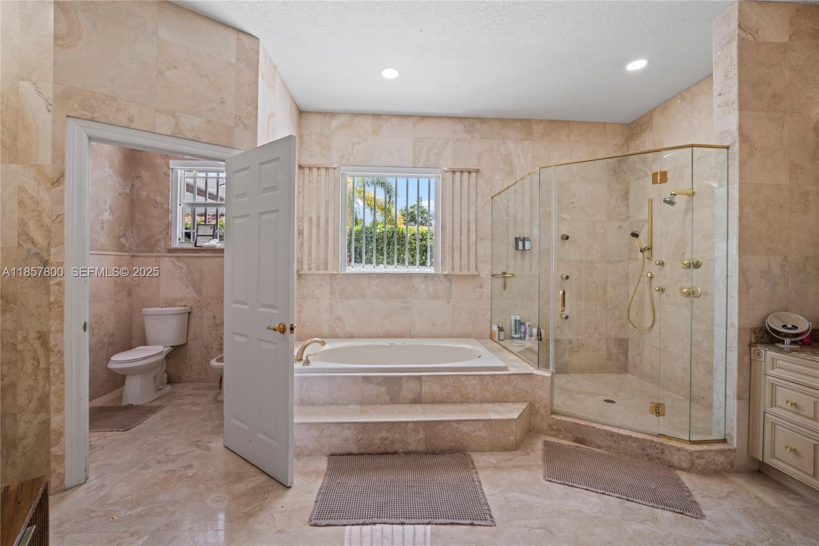 5750 Southwest 67th Avenue Miami, FL 33143 - Photo 48 of 62 a spacious bathroom with a shower a toilet and a shower