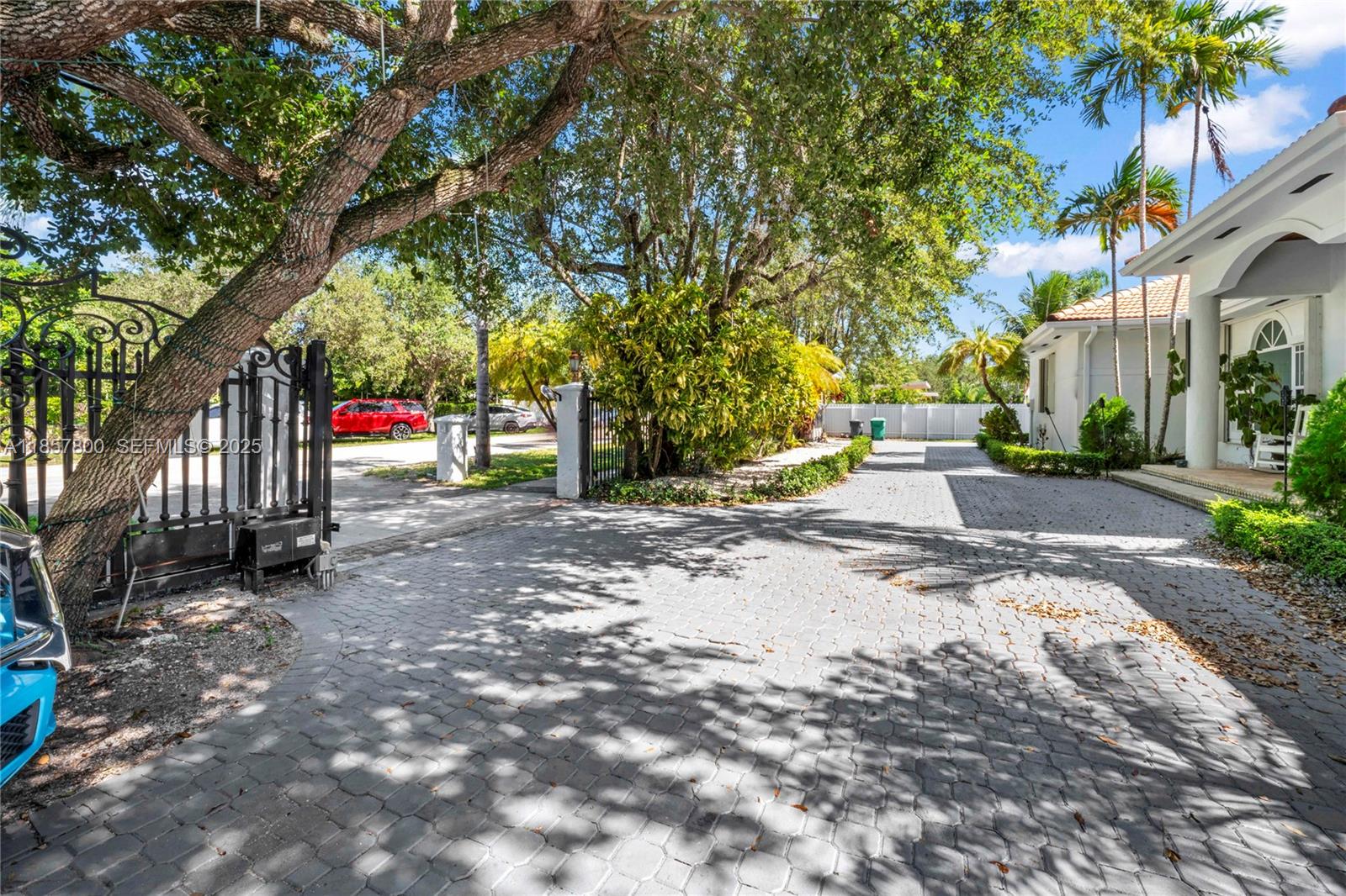 5750 Southwest 67th Avenue Miami, FL 33143 - Photo 6 of 62 a view of road with large trees