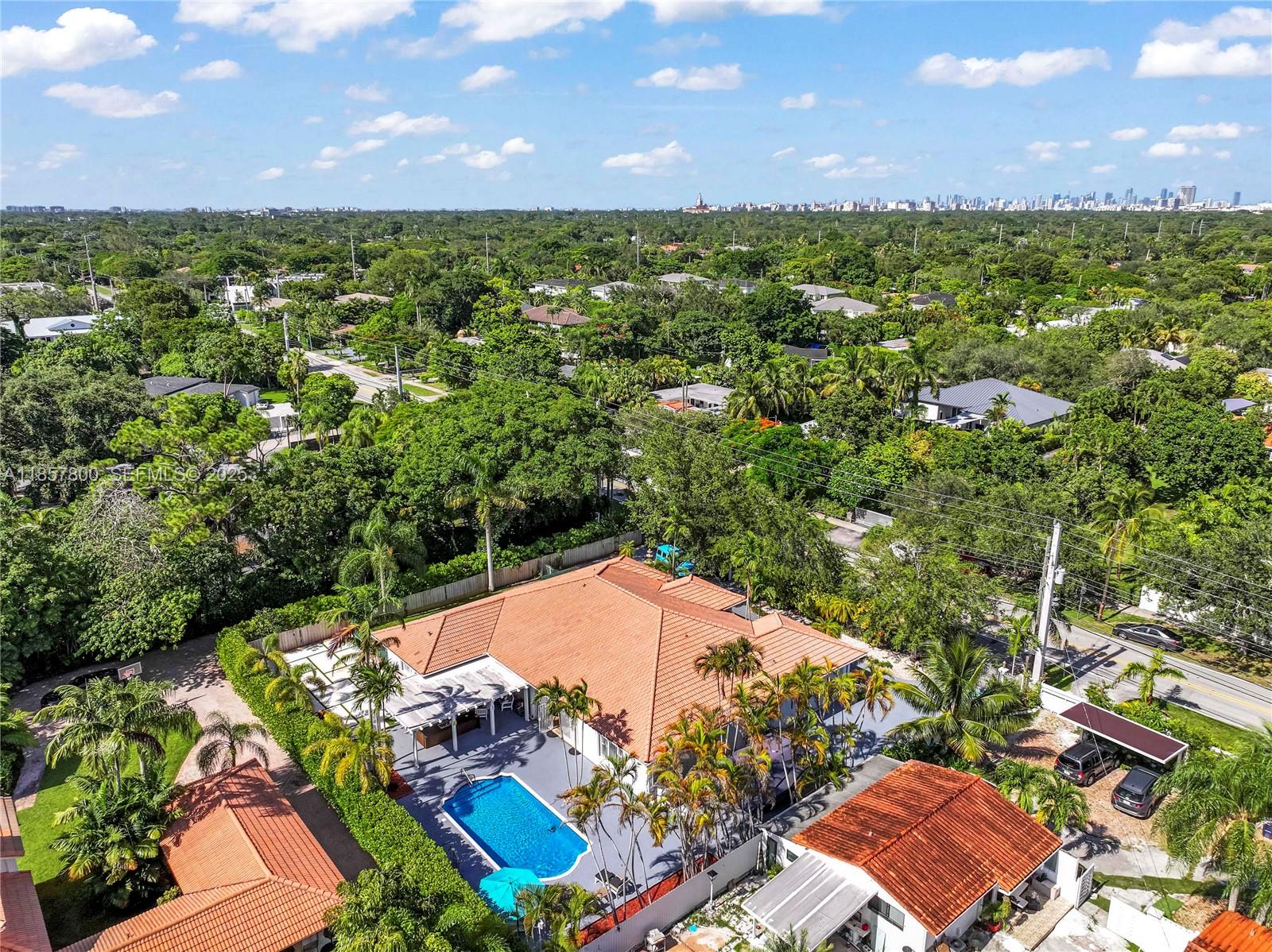 5750 Southwest 67th Avenue Miami, FL 33143 - Photo 8 of 62 an aerial view of residential houses with outdoor space