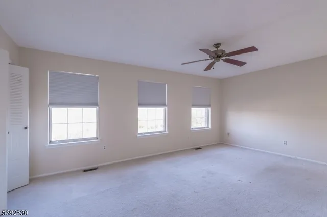 a view of empty room with windows
