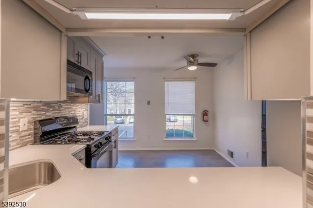 a view of livingroom with furniture and a fireplace