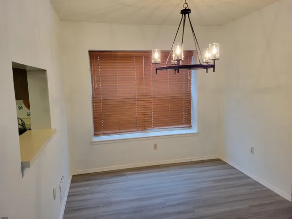 a view of a livingroom with wooden floor