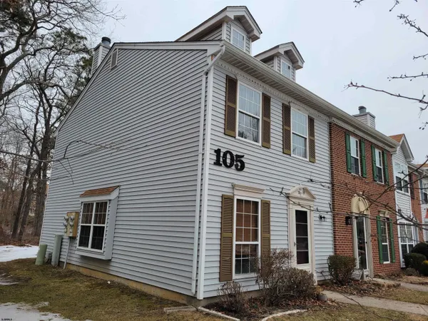a front view of a house with garage