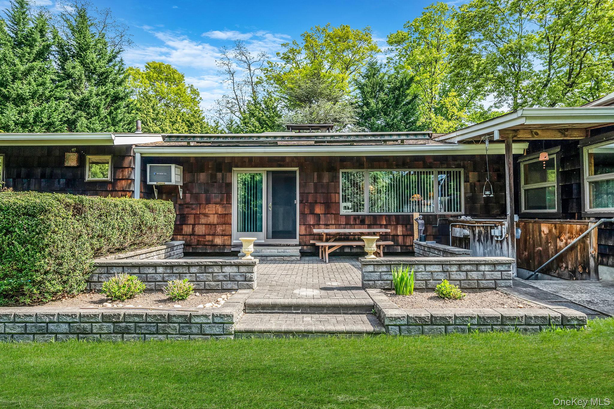 280 Deforest Road North Dix Hills, NY 11746 - Photo 34 of 37 a front view of house with yard and outdoor seating