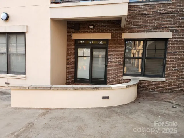 a white bath tub sitting in front of a building