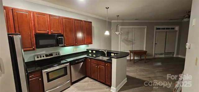 a kitchen with a stove and a microwave