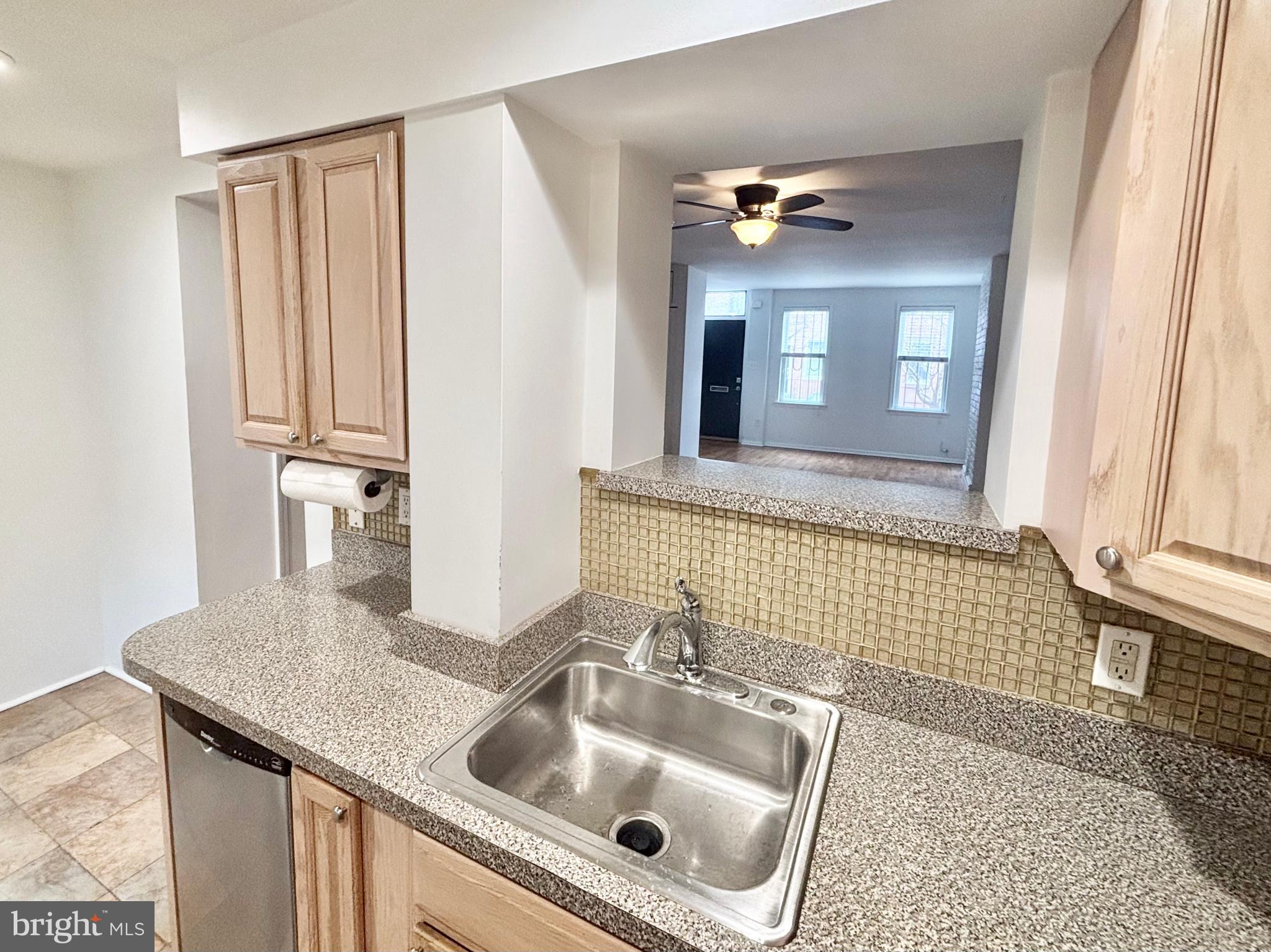 766 Martin Street Philadelphia, PA 19146 - Photo 11 of 35 a bathroom with a granite countertop sink a toilet a mirror and vanity