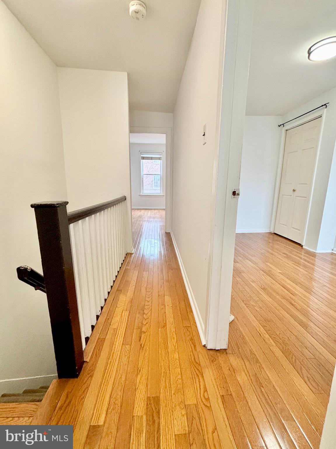 766 Martin Street Philadelphia, PA 19146 - Photo 16 of 35 a view of a hallway with wooden floor and staircase