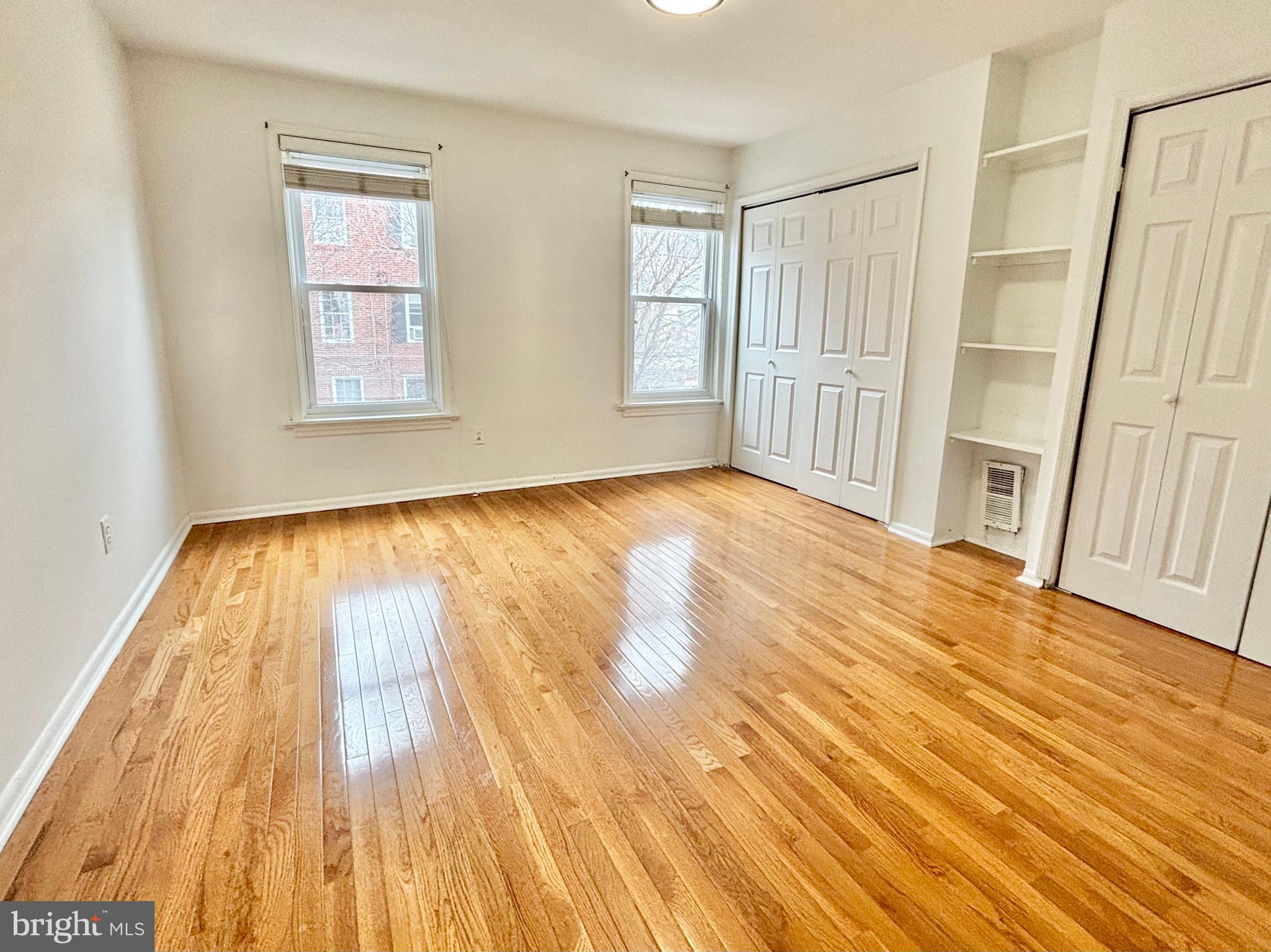 766 Martin Street Philadelphia, PA 19146 - Photo 18 of 35 a view of an empty room with wooden floor and a window