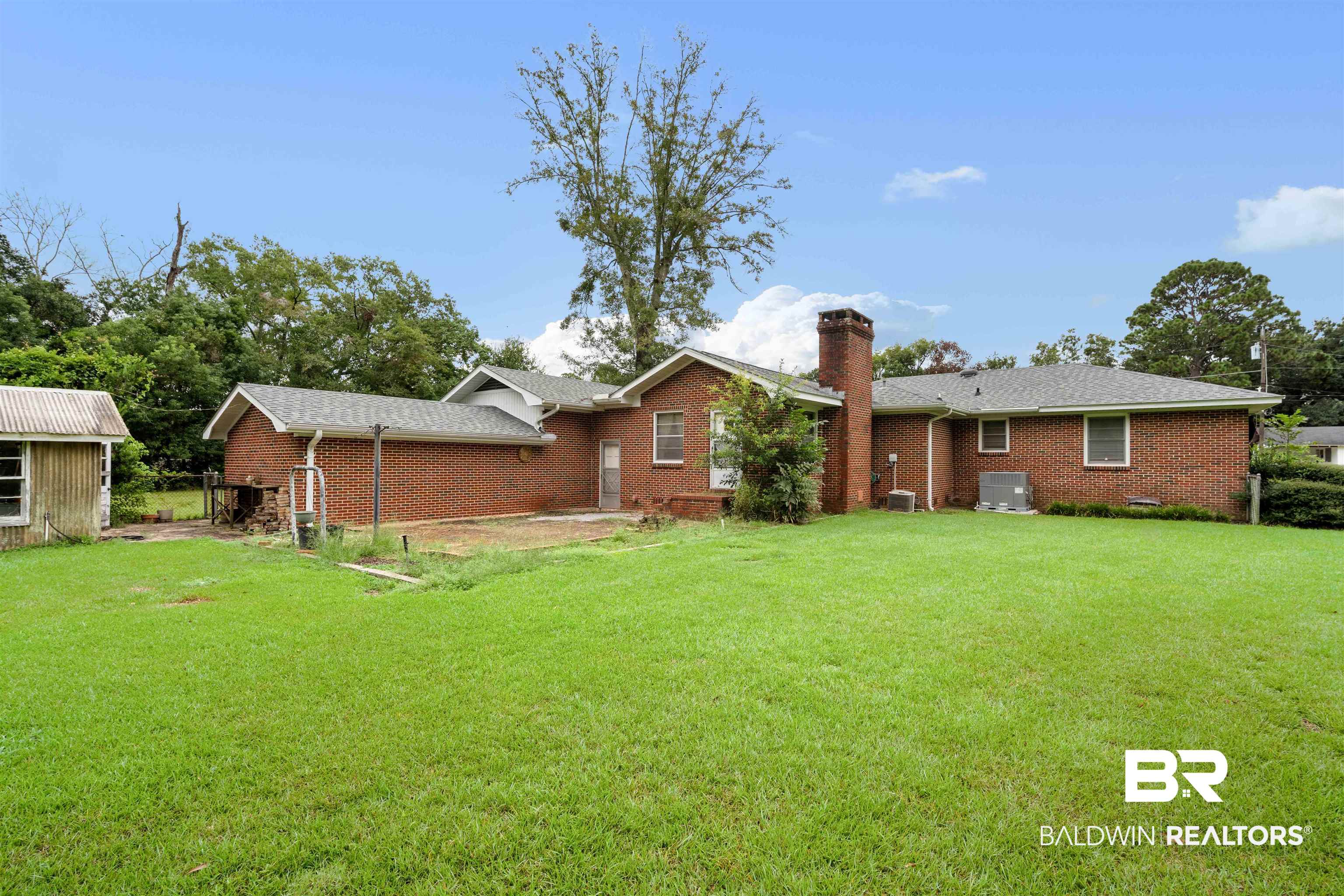 2300 Ellen Drive Mobile, AL 36605 - Photo 23 of 25 Back of house with a yard and cooling unit