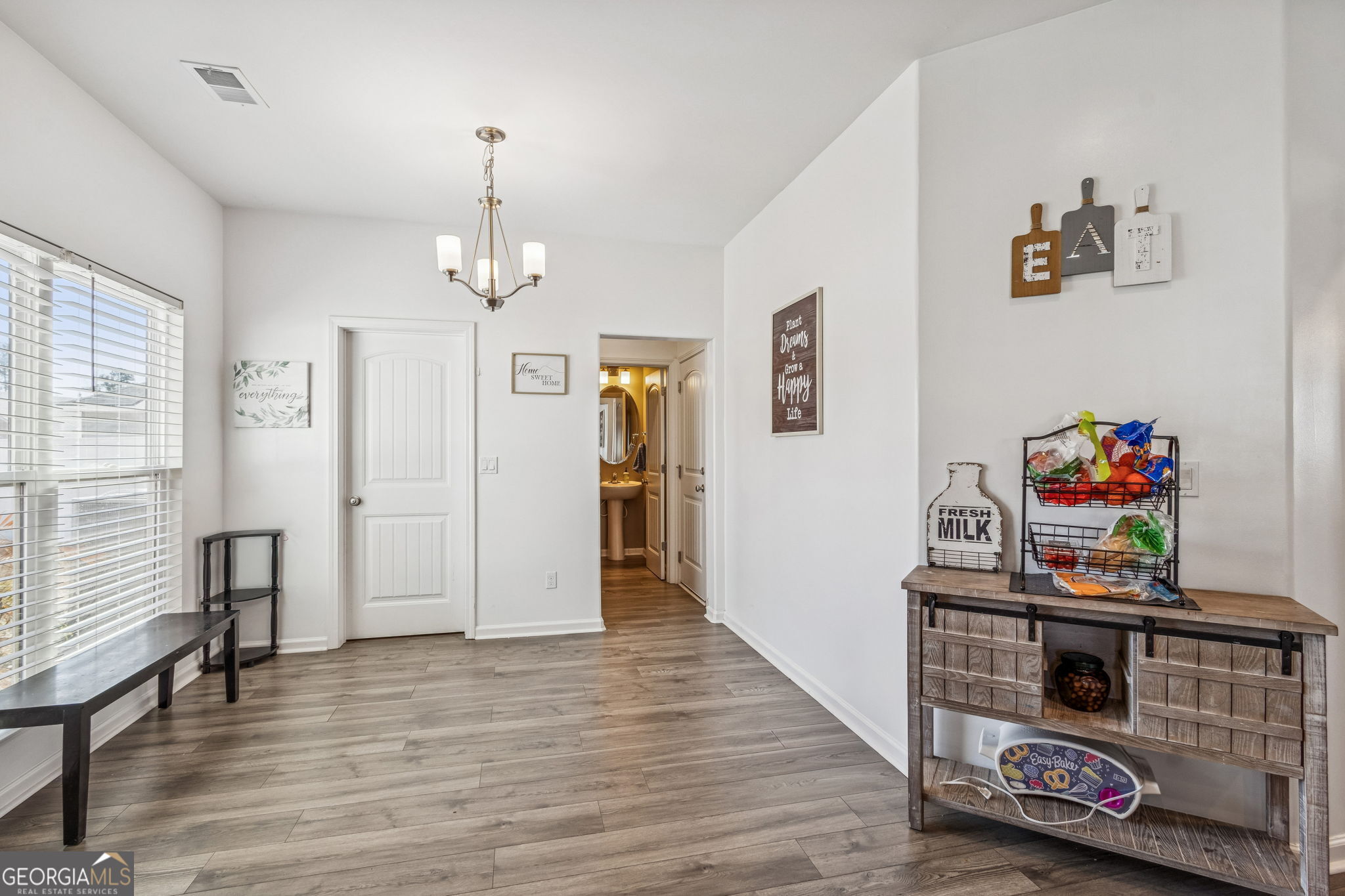 103 Olson Way Kingsland, GA 31548 - Photo 22 of 54 a view of a room with toys and wooden floor