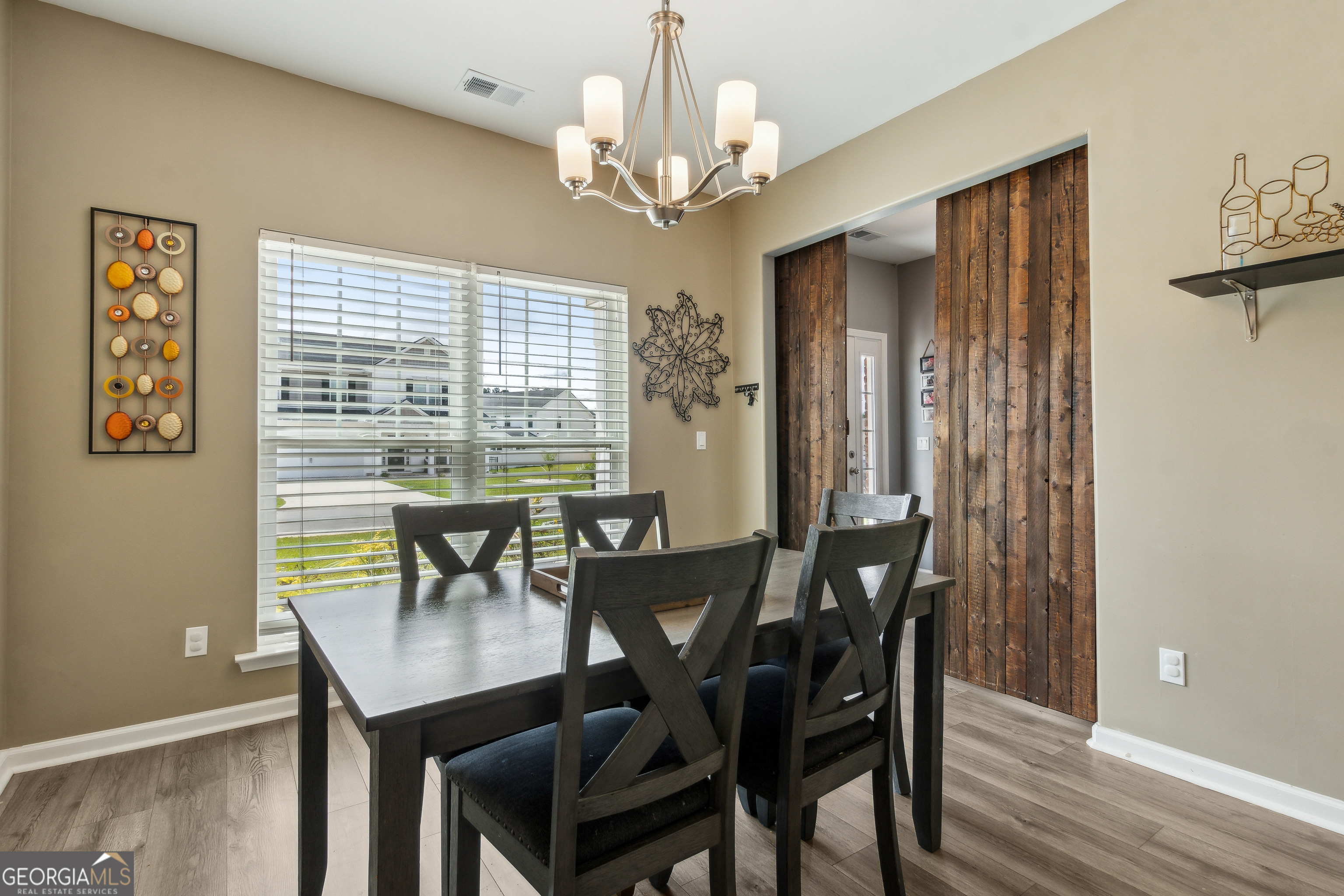 103 Olson Way Kingsland, GA 31548 - Photo 29 of 54 a view of a dining room with furniture window and wooden floor